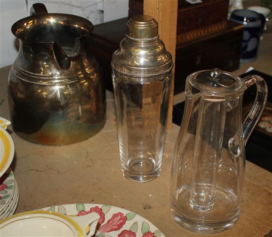 Cut glass decanter, a jug, a cocktail shaker and a cold drinks jug(-)